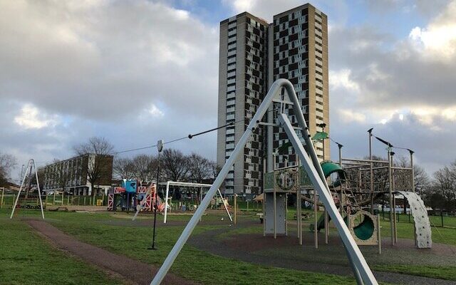 A play area at Mansel Park Southampton. Tower block in the background.